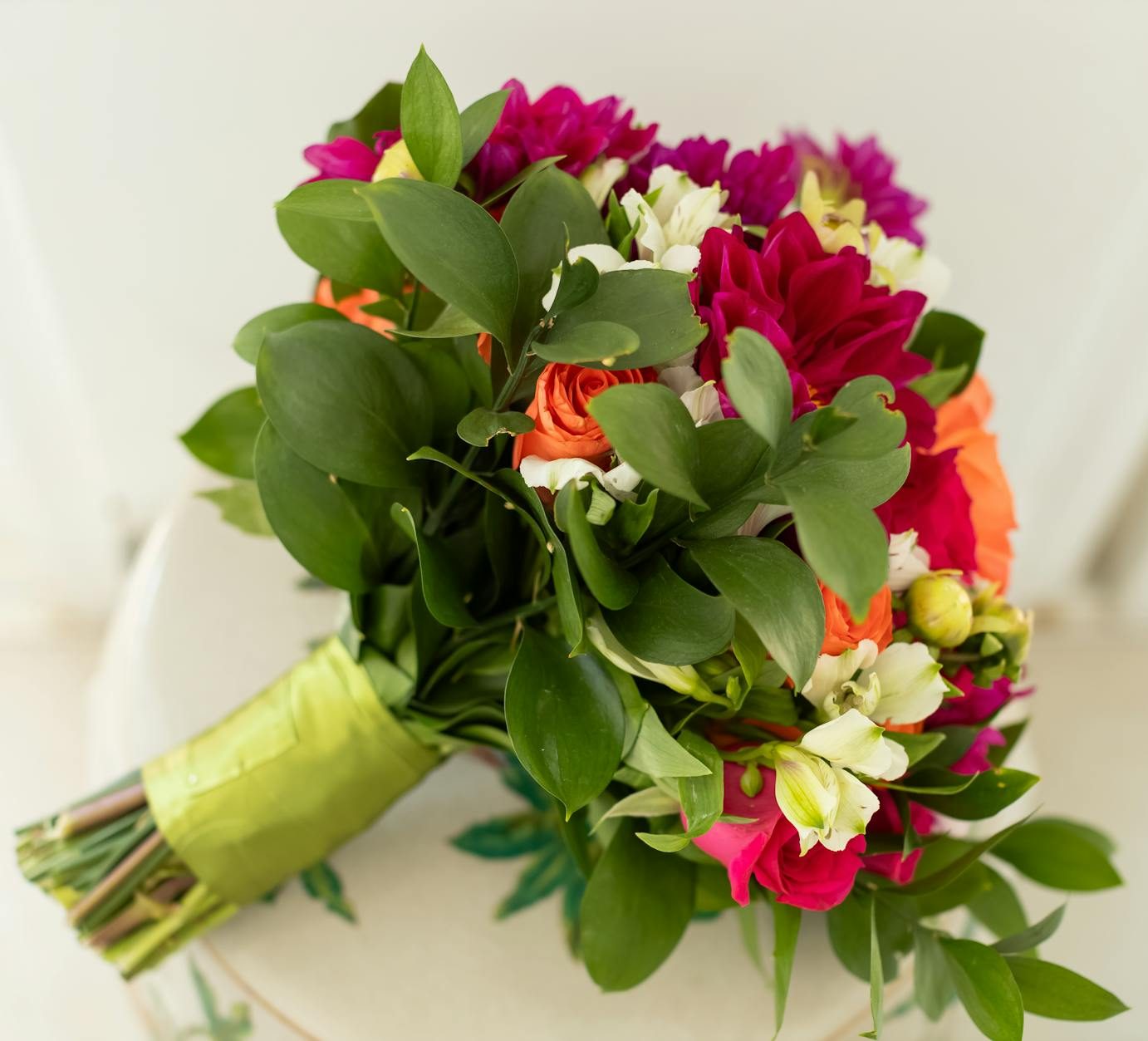 vibrant bouquet of mixed flowers with greenery