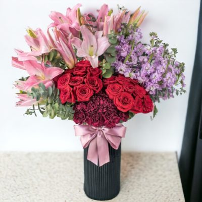 CILINDRO CON ROSAS Y STARGAZER RF429